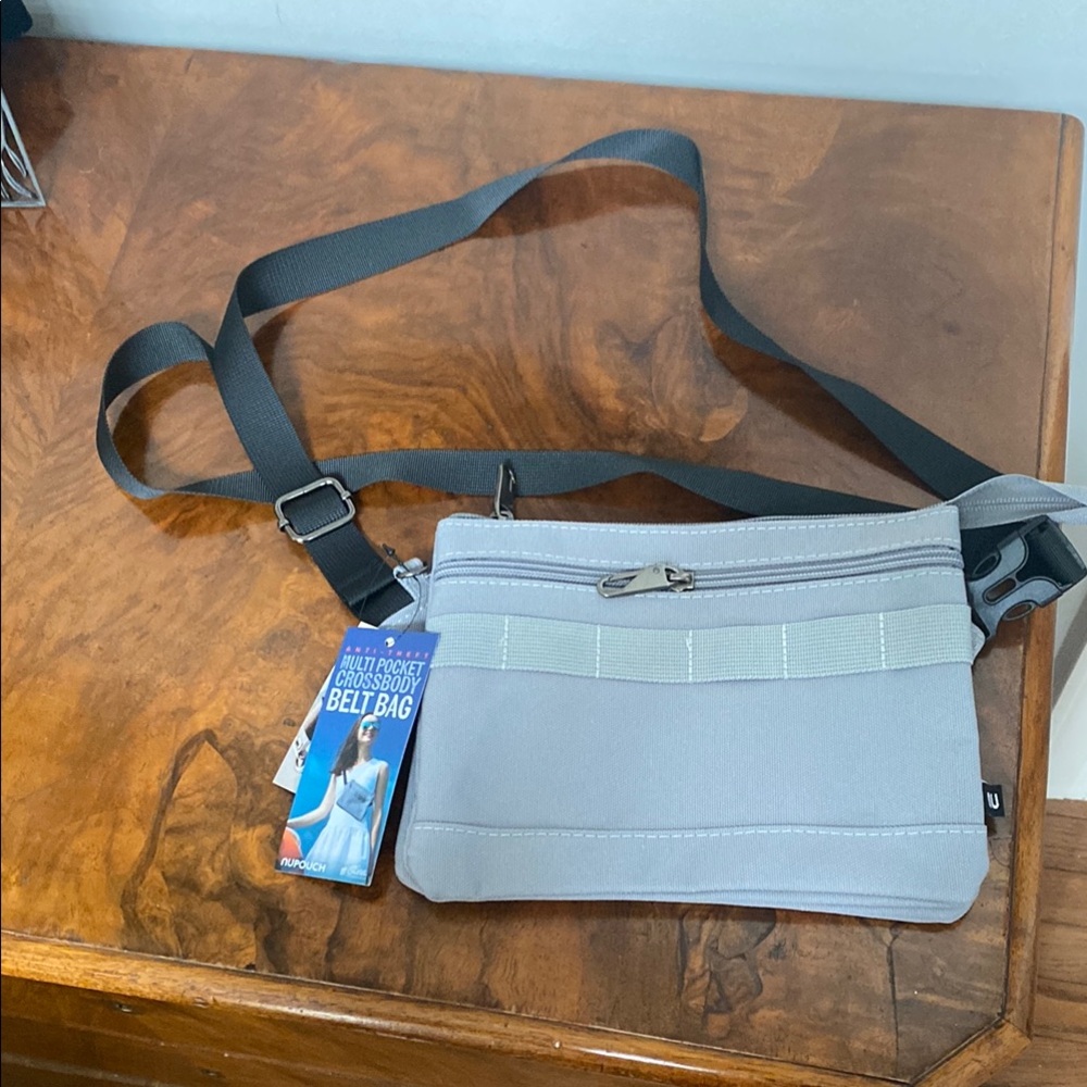 Multi pocket cross body bag. RFID protection  NWT